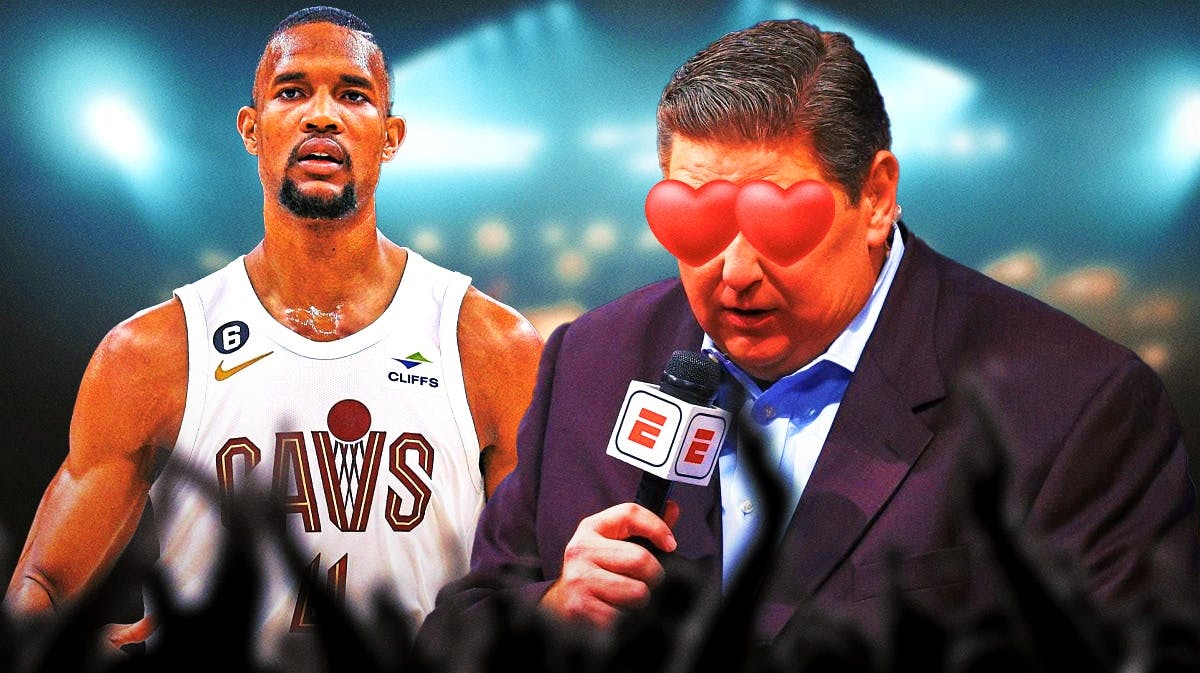 Brian Windhorst on one side with hearts in his eyes, Evan Mobley on the other side