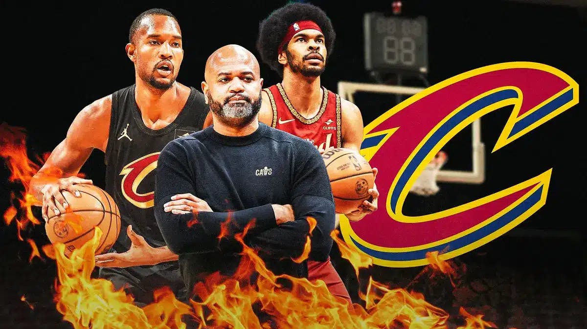 Evan Mobley, Jarrett Allen, and JB Bickerstaff stand next to Cavaliers logo after Mobley's Cavs-Clippers game