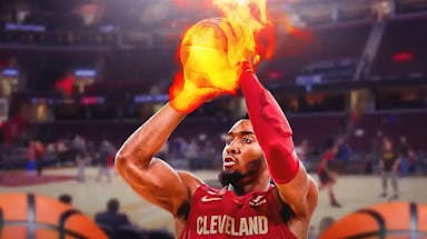 Cavs' Donovan Mitchell shooting a basketball with fire coming off the ball.
